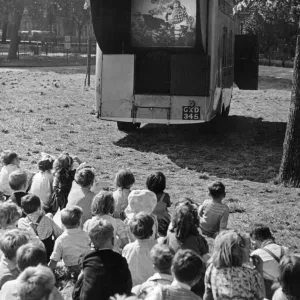 Children watch an open air cinema performance of Ralph Readers Gang Show Children watch an open air cinema performance of Ralph Readers Gang Show