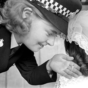 Children wedding has Police guard: Police guard for child bride wearing Pilkington