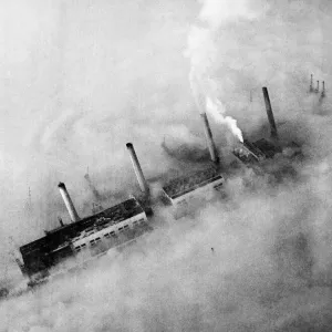 Chimneys of an East End factory poke through the blanket of smog covering London