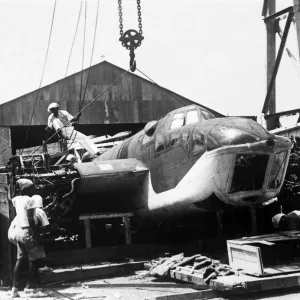 Chinese labourers prising open the case on the arrival of the Bristol Blenheim Mark IV Chinese labourers prising open the case on the arrival of the Bristol Blenheim Mark IV