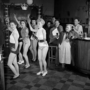 Chorus girls rehearse in the bar of The Jolly Tanners pub. 27th March 1954