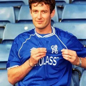 Chris Sutton, poses for the media during a photocall at Stamford Bridge after signing a Chris Sutton, poses for the media during a photocall at Stamford Bridge after signing a