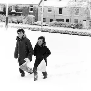 Christian Clapton (left) and Paul Isbel (right) trudge through the thick snow to get to Christian Clapton (left) and Paul Isbel (right) trudge through the thick snow to get to