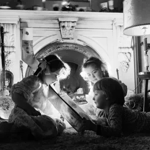 Christmas Eve, Children reading bedtime stories as they wait for Santa, Newcastle