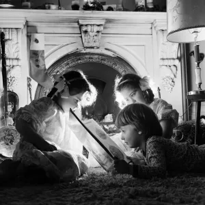 Christmas Eve, Children reading bedtime stories as they wait for Santa, Newcastle