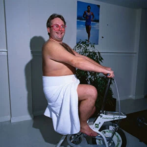 Christopher Biggins 1985 on exercise bicycle gymnasium