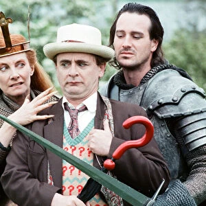 Christopher Bowen as Mordred crosses swords with Sylvester McCoy as the Doctor along