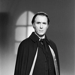Christopher Lee, being photographed for poster, dressed as character Dracula in film