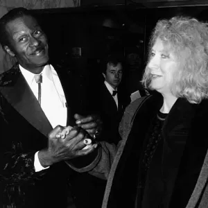 Chuck Berry greets woman at film premiere 1988 Holding hands Chuck Berry greets woman at film premiere 1988 Holding hands