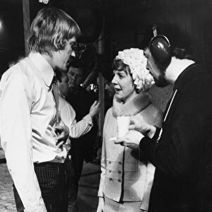 Cilla Black and David Warner with Peter Hall on the set of film Work is a Four Letter