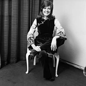 Cilla Black, who is playing Aladdin at the Palladium, tries on her costume for the first