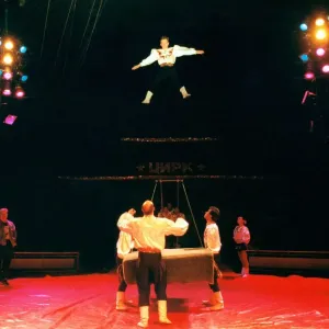 Circus performers practicing before the crowds come in Circus performers practicing before the crowds come in