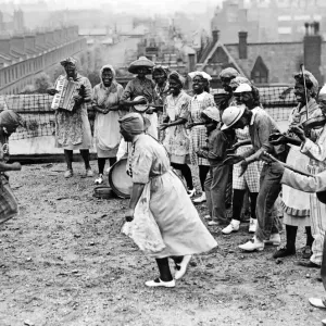 Civil Defence workers performing a Minstrel concert party on top of Southwark Town Hall