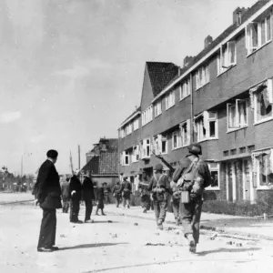 Civilians watch Canadian troops pass through Groningen, Netherlands, after its liberation Civilians watch Canadian troops pass through Groningen, Netherlands, after its liberation