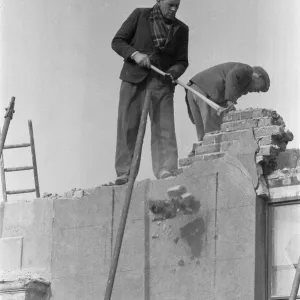 Clearing bomb damage buildings in Bromley by Bow. 3rd March 1955