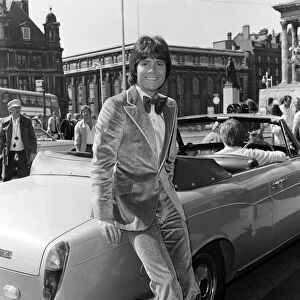 Cliff Richard leaving a Birmingham hotel for location work on his latest film