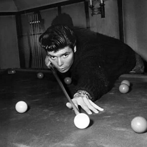 Cliff Richard playing pool in his new home Rookswood, Essex, UK