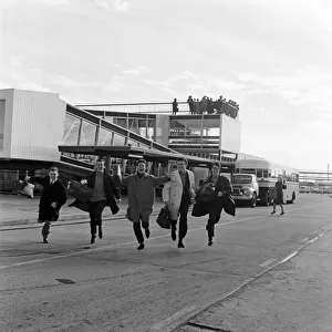 Cliff Richard and the Shadows at London Airport. Pictured running across the tarmac as