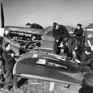 A clipped wing Spitfire Print, a photograph of the aircraft being serviced A clipped wing Spitfire Print, a photograph of the aircraft being serviced