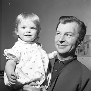 Clive Dunn actor with his 18 month old daughter Polly 5th March 1962