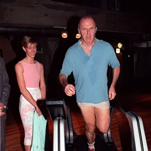 Clive James TV presenter on treadmill February 1990 On running machine