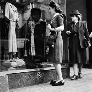 Clothes Ration Birmingha: Women window shopping in. July 1946 P010058