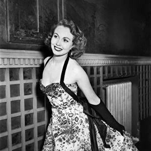 Clothing Fashion 1953. Miss Hazel Court arrives wearing a black velvet floral design