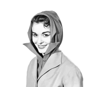 Clothing: Fashion: Hats: Woman wearing hat and scarf combined. 1958