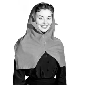 Clothing: Fashion: Hats: Woman wearing hat and scarf combined. 1958 B427-002