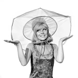 Clothing: Fashion: Hats: Woman wearing umbrella hat. Model: Marilyn Rickard