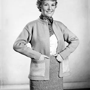 Clothing: Fashion: Knitwear: Petula Clark modelling cardigan. April 1956 B470-003