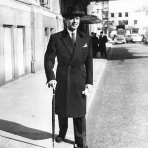 Clothing Fashion: Mens wear: This double-breasted town overcoat is in black Clothing Fashion: Mens wear: This double-breasted town overcoat is in black