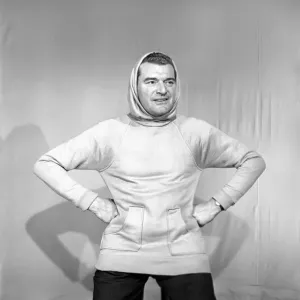 Clothing: Fashion: Menswear. Man wearing hooded sweat shirt. 1958 B116