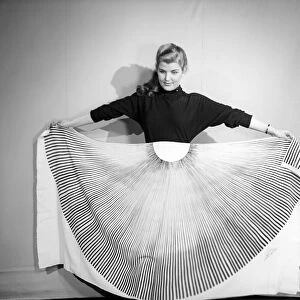 Clothing: Fashion: Skirts: Woman wearing pleated skirt. 1953 B127