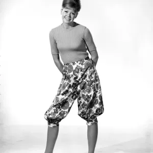 Clothing: Fashion: Trousers: Model wearing floral pattern pants. 1966