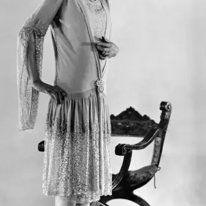 Clothing. This very pleasing evening gown is of pale cyclamen georgette and lace Clothing. This very pleasing evening gown is of pale cyclamen georgette and lace