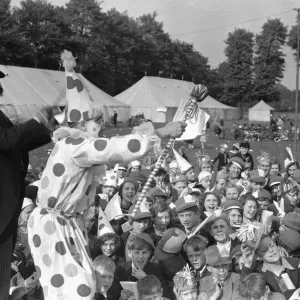 Clowns seen here performing at the Twickenham Garden Fete. Circa 1930 Clowns seen here performing at the Twickenham Garden Fete. Circa 1930