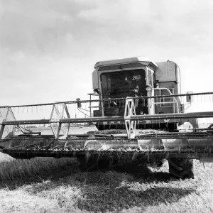 A Cls combine harvester opening up a field of winter barley A Cls combine harvester opening up a field of winter barley