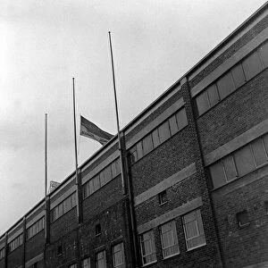The club flag of Manchester United flying at half mast at Old Trafford in memory of