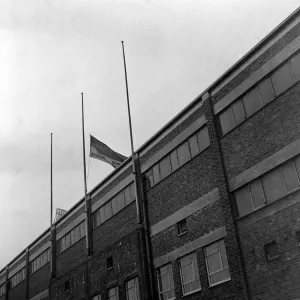 The club flag of Manchester United flying at half mast at Old Trafford in memory of The club flag of Manchester United flying at half mast at Old Trafford in memory of