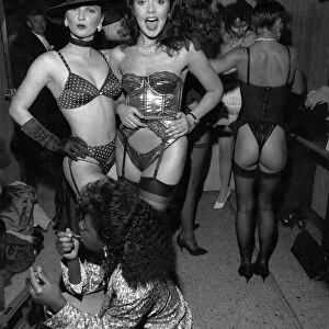 Clubs night clubs. Women in underwear. Basque, hat, bra, thong, suspenders