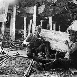 Coal Mines underground scenes. Workers having a break. December 1937
