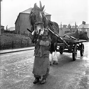 Coalman delivering coal. May 1958 A687-008