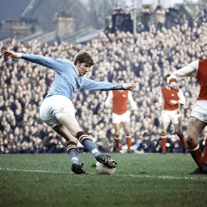 Colin Bell in action for Manchester City against Arsenal during their English League