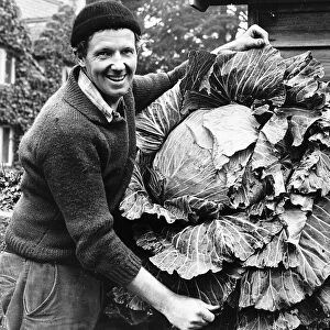 Colin Bowcock winner of the Sunday People Grow A Cabbage Contest Man smiling with