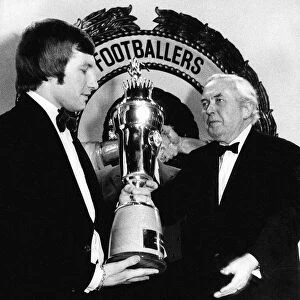 Colin Todd receives the PFA Player of the Year trophy from the Prime Minister Harold