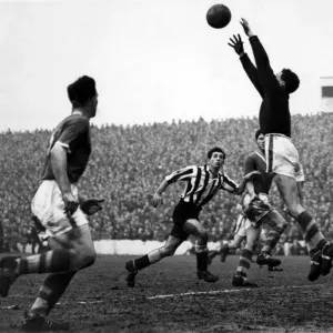 collect a high ball as Newcastle Uniteds Curry dashes in to challenge- 6th March collect a high ball as Newcastle Uniteds Curry dashes in to challenge- 6th March