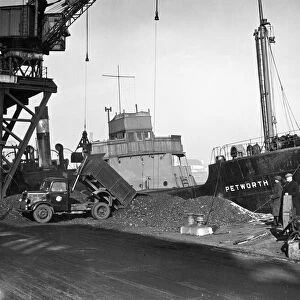 The Collier SS Petworth unloading her cargo of coal at Soreham gasworks, Sussex