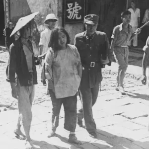 A Colonel and a Chinese labourer who are Air Raid Precaution officers A Colonel and a Chinese labourer who are Air Raid Precaution officers