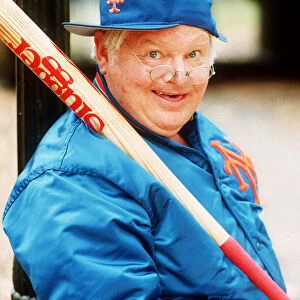 Comedian Benny Hill with baseball bat cap and jacket November 1989